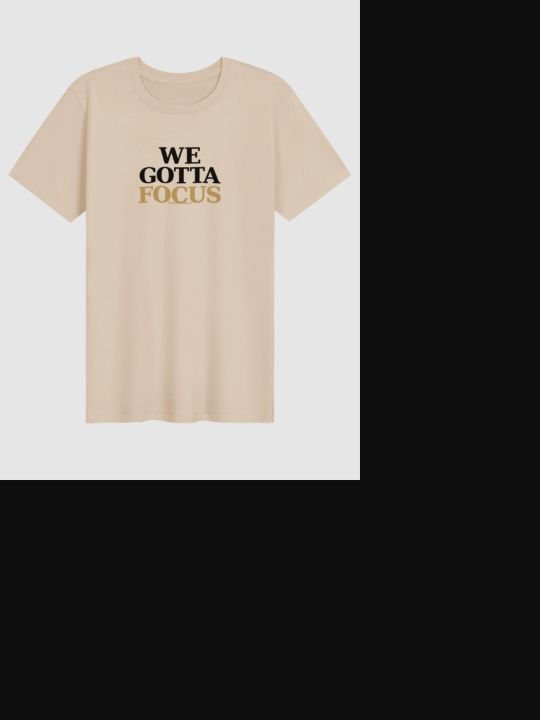 WE GOTTA FOCUS printed on a soft cream Bella+Canvas T-shirt